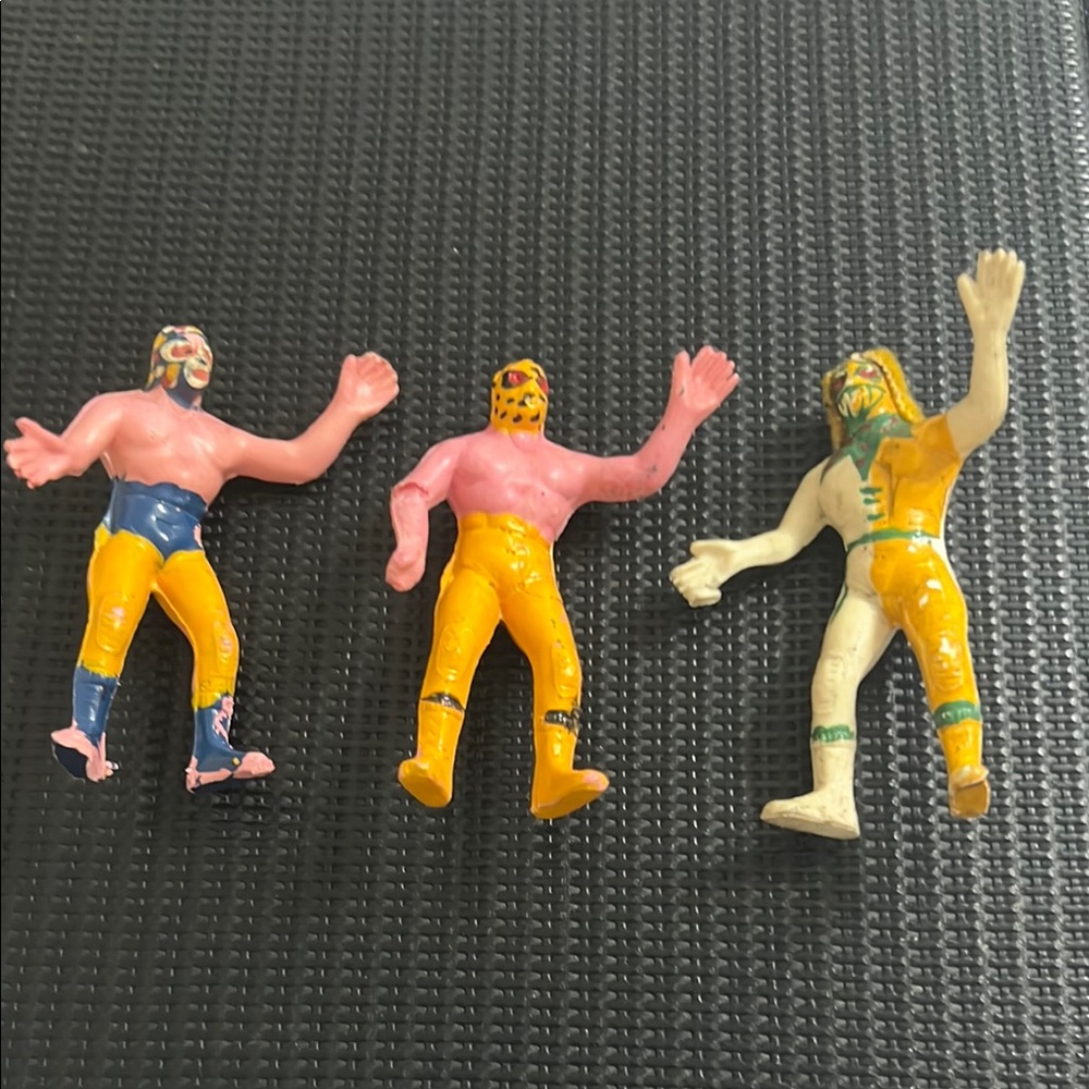Vintage Mexican plastic wrestling figures.